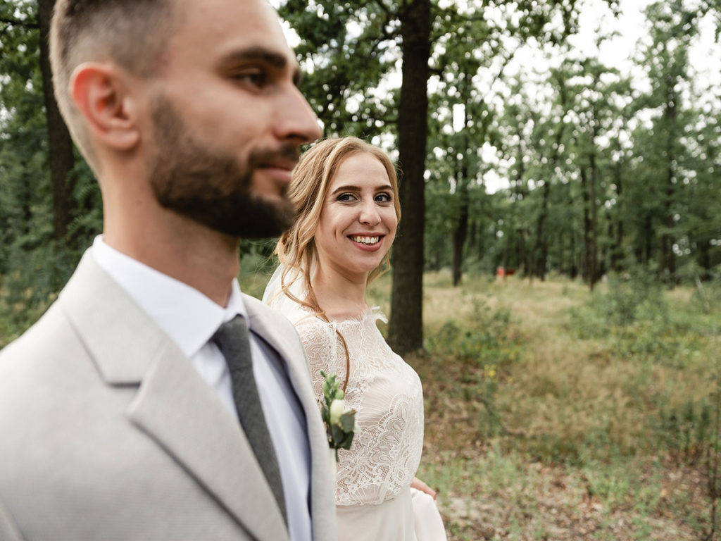 Bride stares lovingly at groom