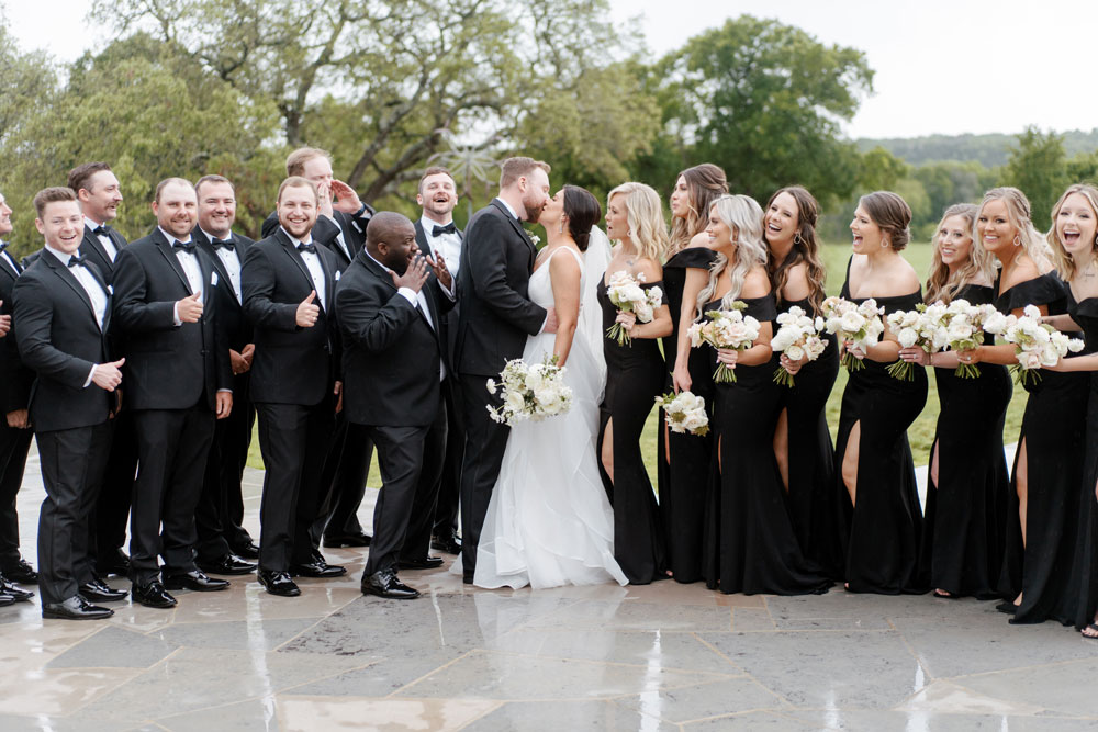 Wedding Bridal Party poses outside Texas wedding