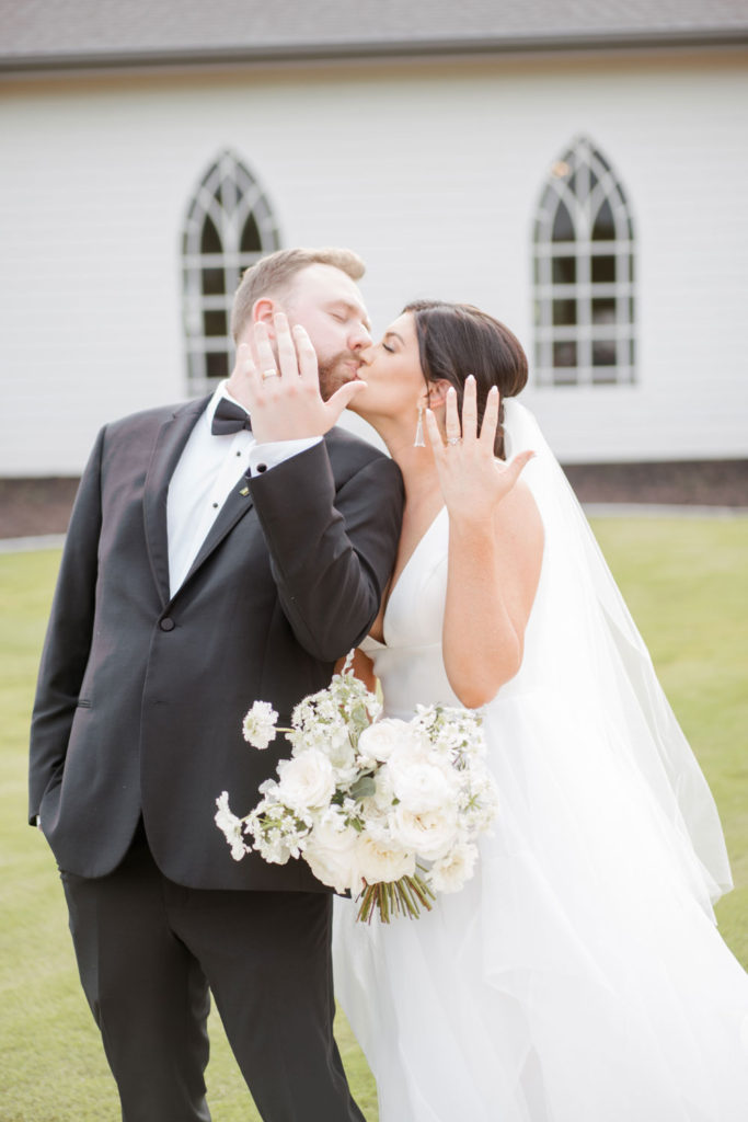 Bride And Groom show off wedding rings at Texas wedding